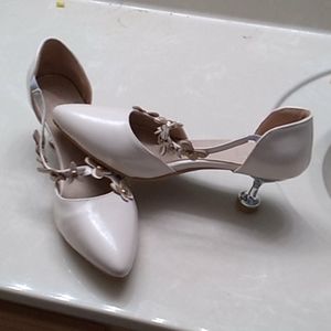 Beige pumps with silver heels
